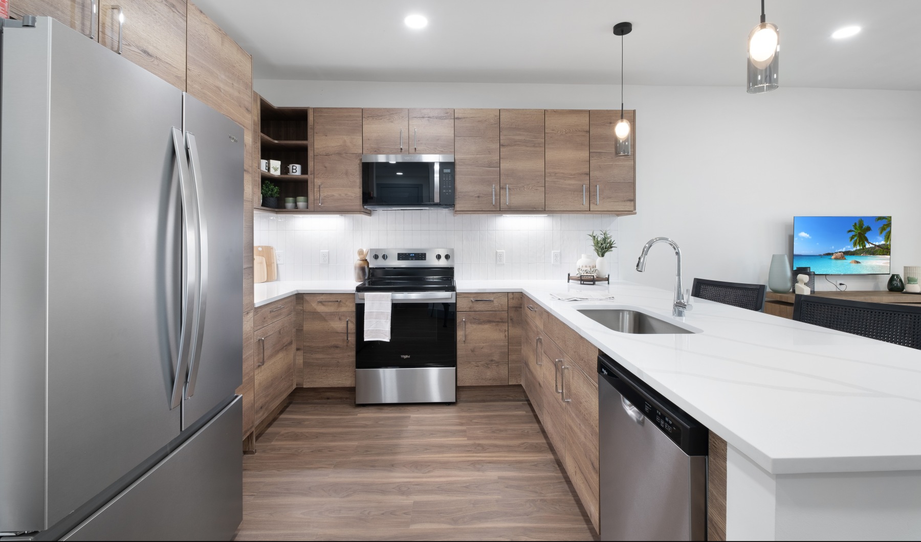 Luxury kitchen with contemporary cabinetry and spacious countertops