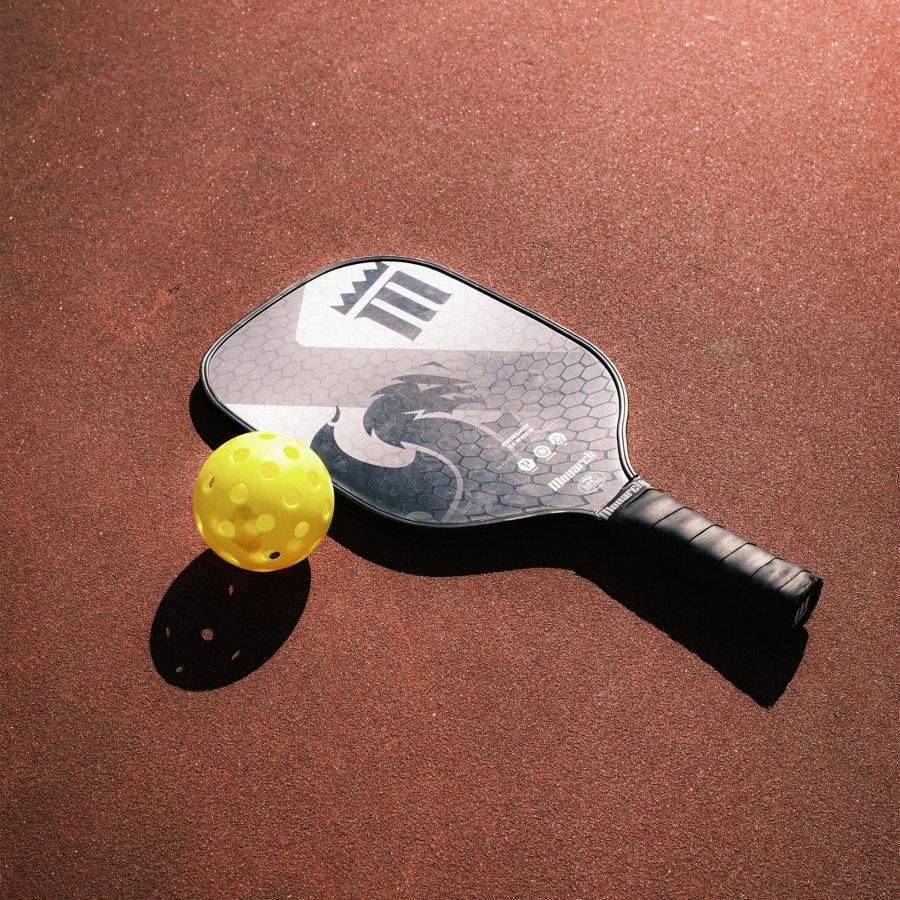 State-of-the-art amenities a Pickleball ball and a racket